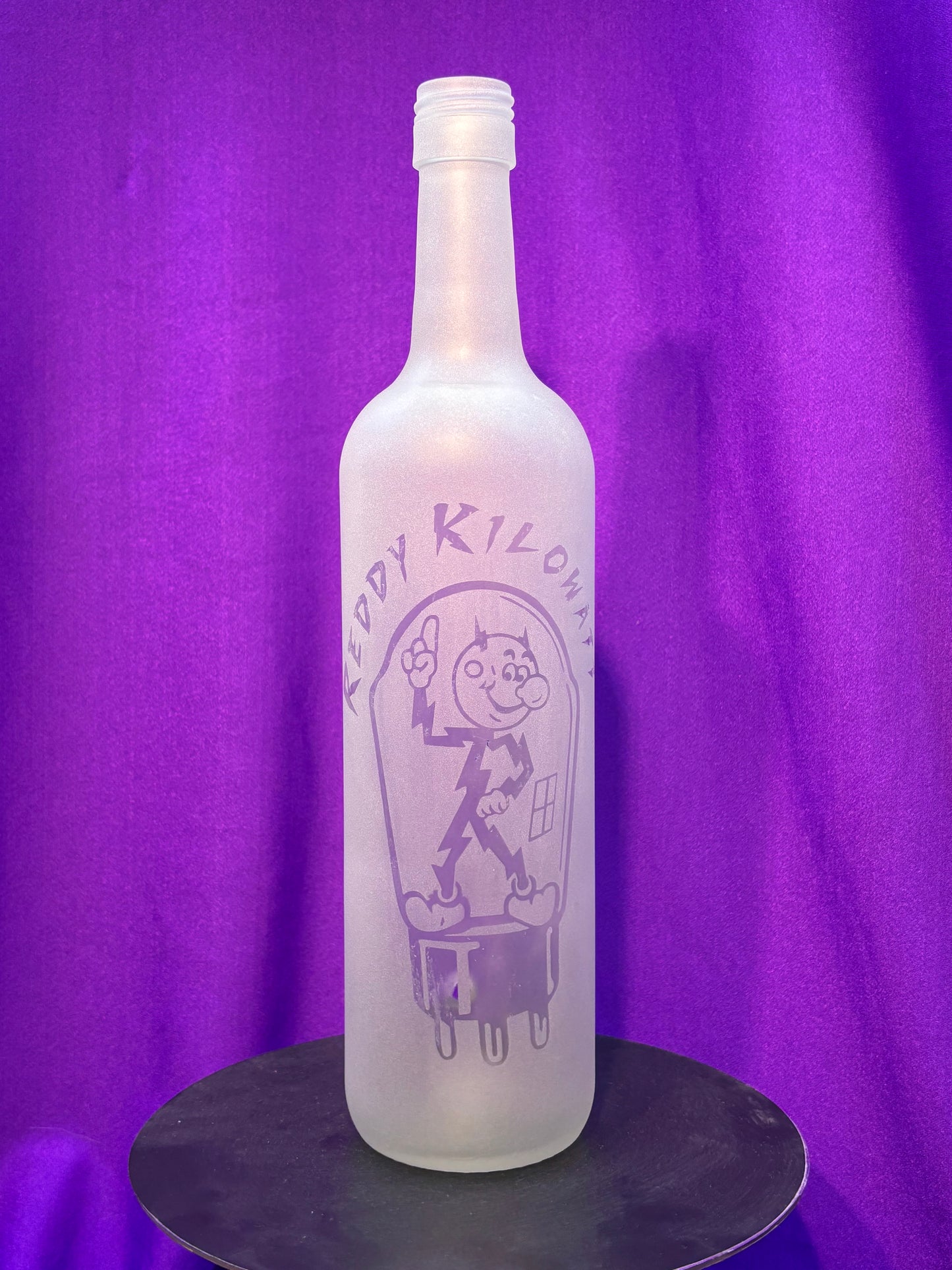 Sandblasted Reddy Kilowatt Incense Holder Bottle